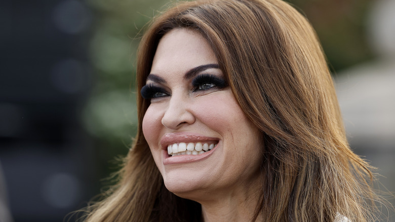 Kimberly Guilfoyle smiling with thick eye makeup