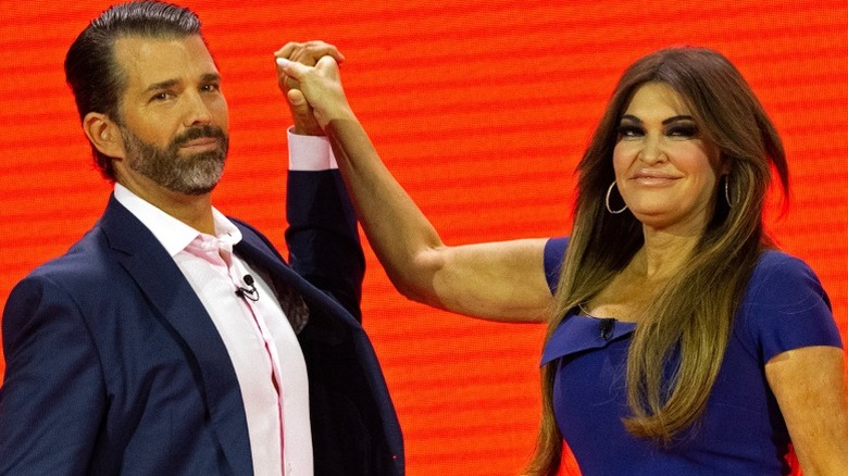 Donald Trump Jr. and Kimberly Guilfoyle awkwardly hold hands at CPAC (2023)