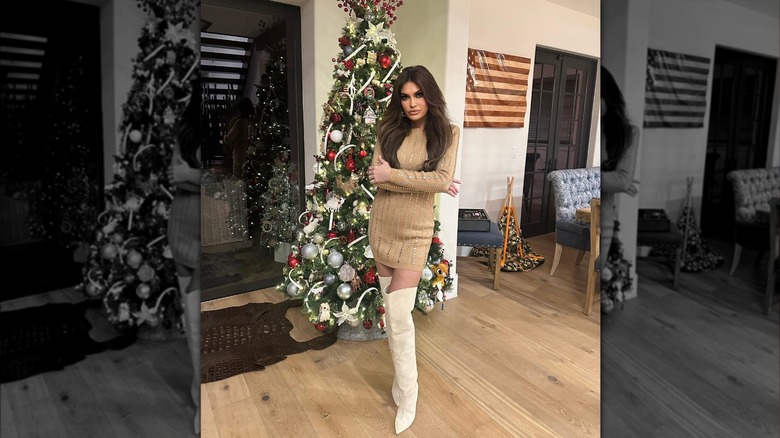 Kimberly Guilfoyle posing in front of christmas tree