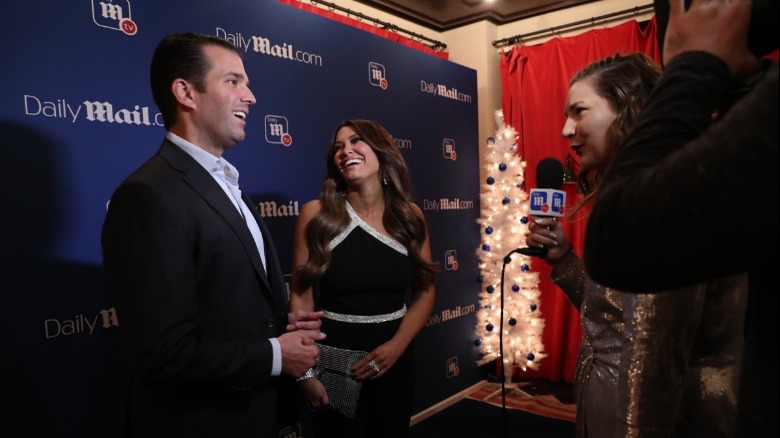 Donald Trump Jr. and Kimberly Guilfoyle laughing during interview