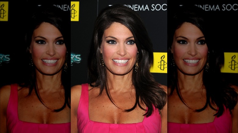 Kimberly Guilfoyle smiling in pink dress