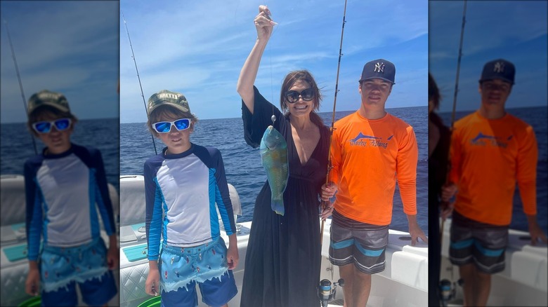 Kimberly Guilfoyle holding fish on line