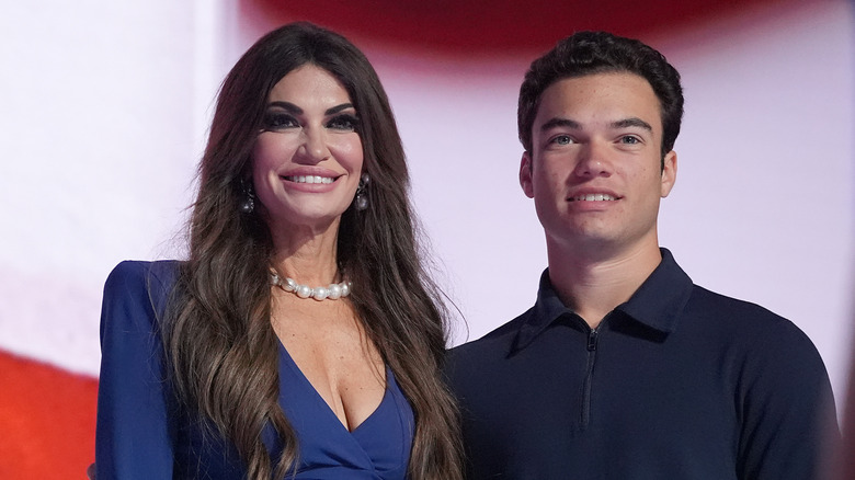 Kimberly Guilfoyle and Ronan Villency posing for photos at the 2024 Republican National Convention