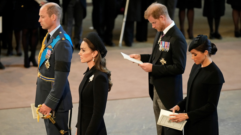 Prince William, Kate, Prince Harry, Meghan standing