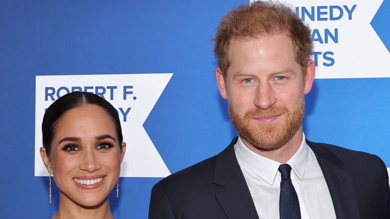 Meghan Markle and Prince Harry posing