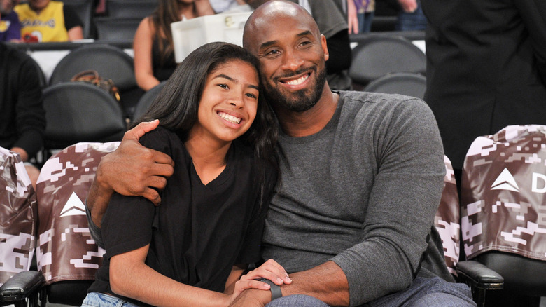 Gianna Bryant and Kobe Bryant at a game