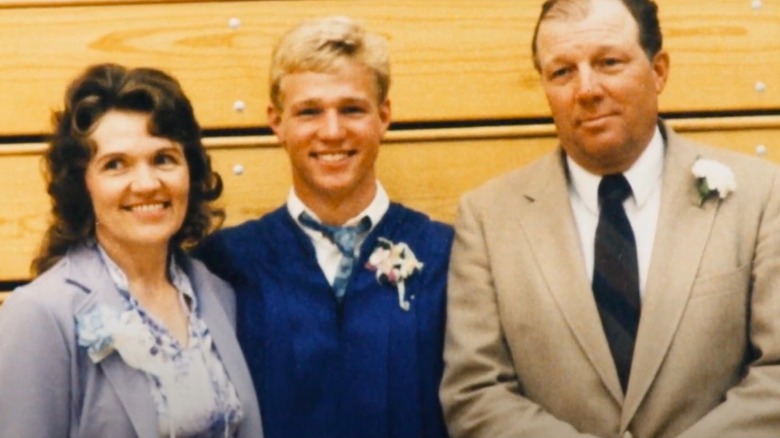 Young Kody Brown posing with his parents