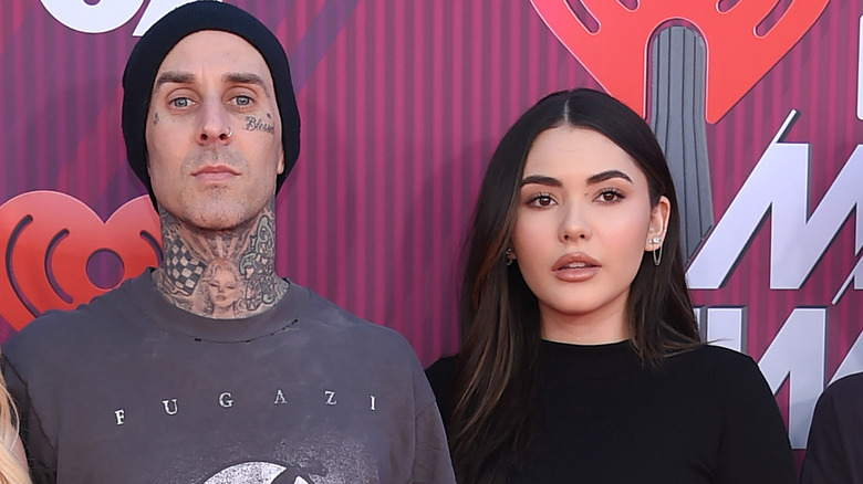 Travis Barker and stepdaughter Atiana De La Hoya attending an event