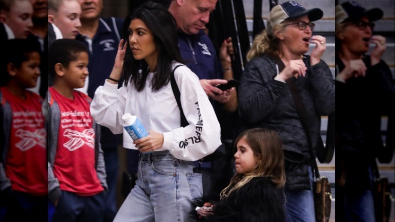 Kourtney Kardashian attending basketball game with daughter Penelope Disick