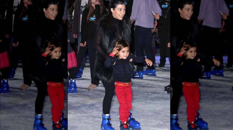 Kourtney Kardashian and Mason ice skating