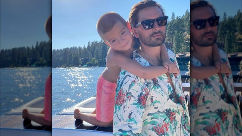 Scott Disick and Reign Disick boating together