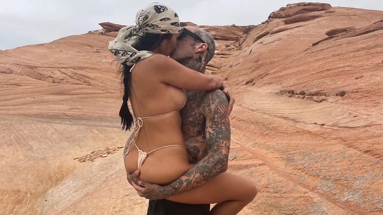 Kourtney Kardashian and Travis Barker kissing