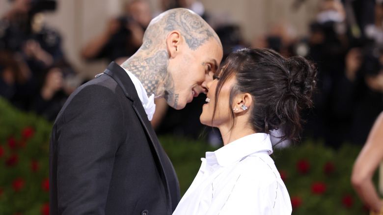 Travis Barker and Kourtney Kardashian about to kiss