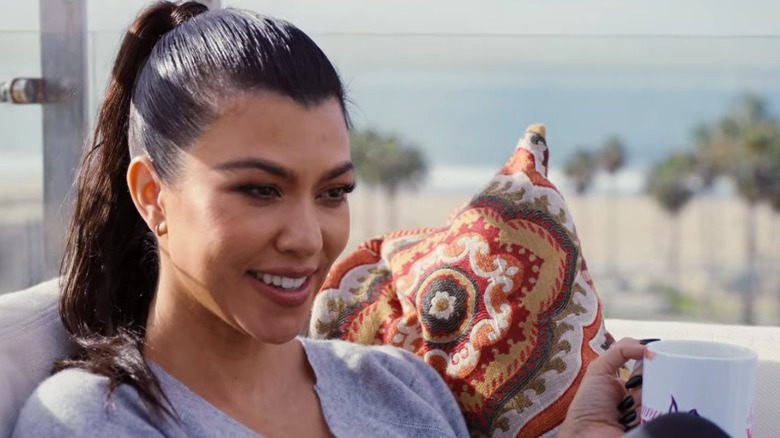 Kourtney Kardashian holding coffee cup