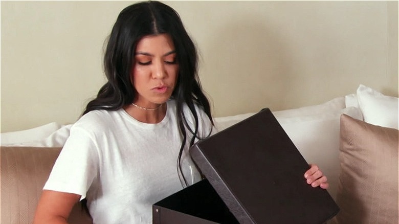 Kourtney Kardashian holding box