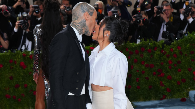 Kourtney Kardashian and Travis Barker kissing