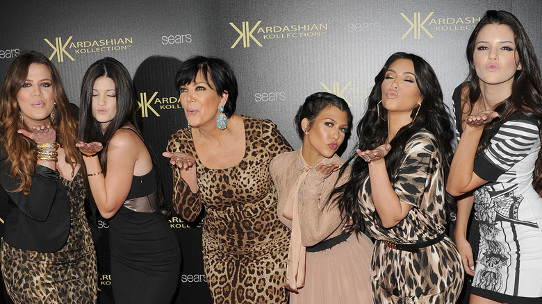 Kardashian family in line blowing kisses