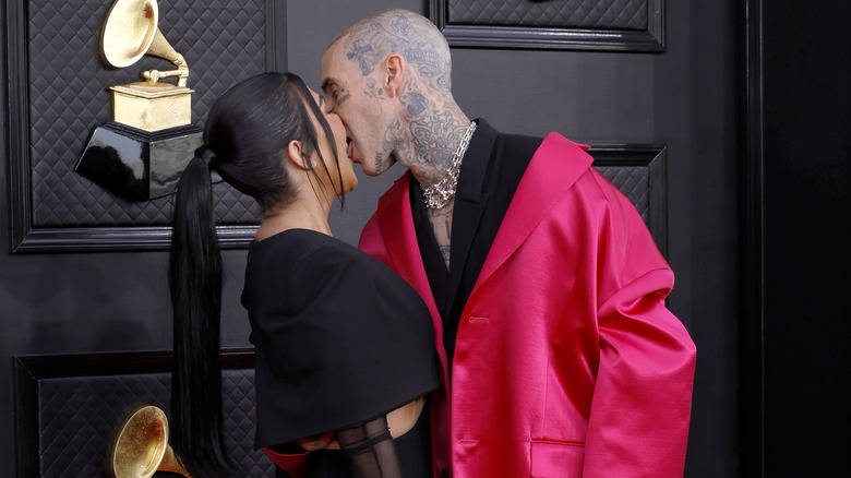 Travis Barker and Kourtney Kardashian kiss