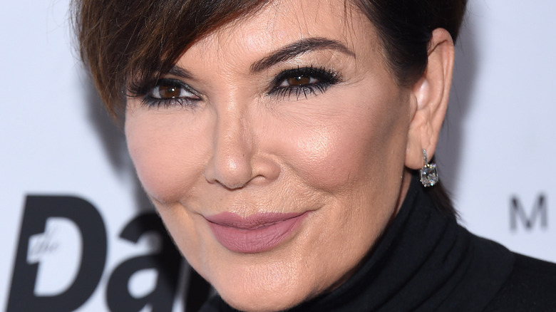 Kris Jenner wearing diamond earrings