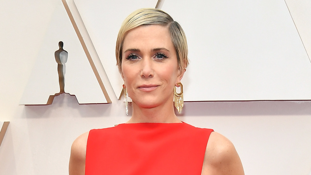 Kristen Wiig poses on the 2020 Oscars red carpet