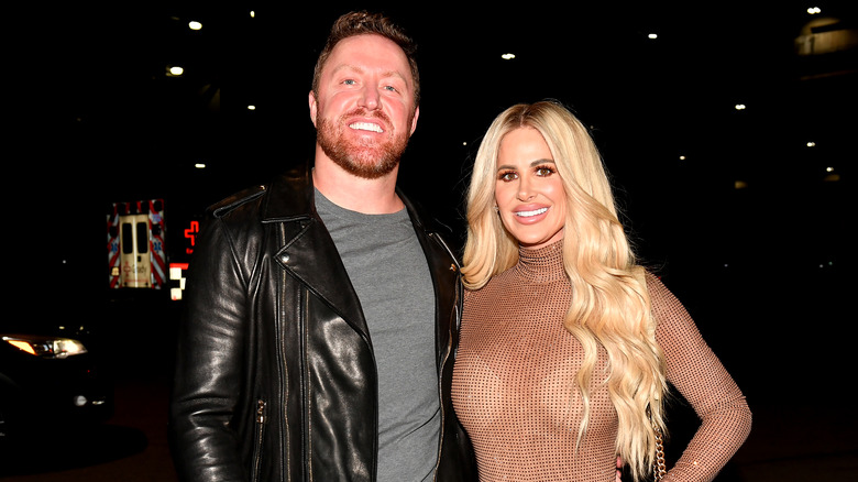 Kroy Biermann and Kim Zolciak pose 