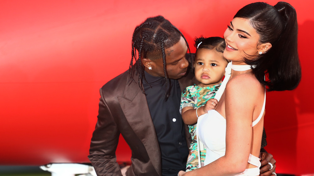 Kylie Jenner poses with Stormi, and her ex, Travis Webster