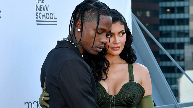 Kylie Jenner and Travis Scott pose at an event in 2021