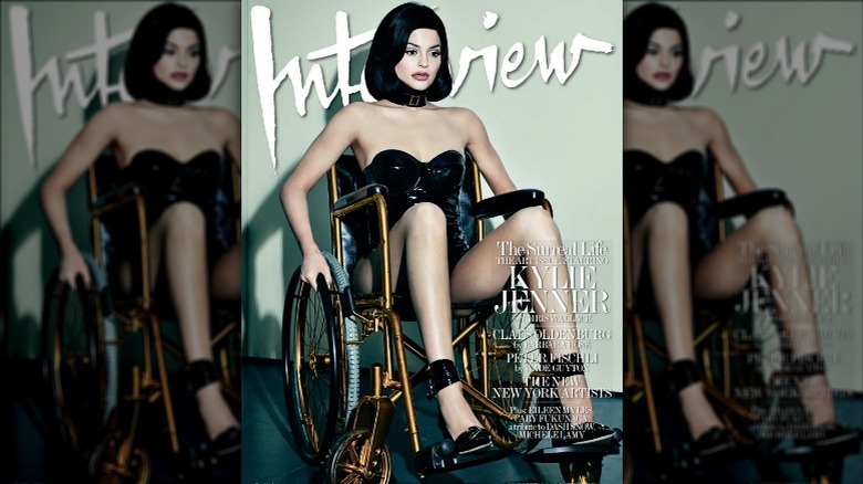 Kylie Jenner sitting in wheelchair