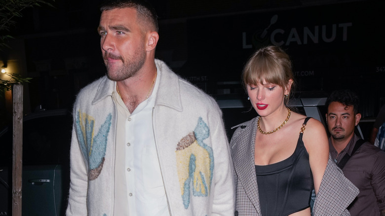 Travis Kelce and Taylor Swift walking