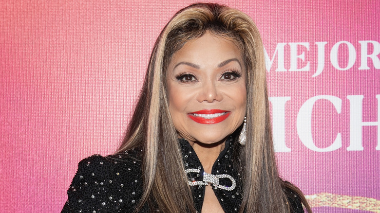 La Toya Jackson wearing bright lipstick on the red carpet