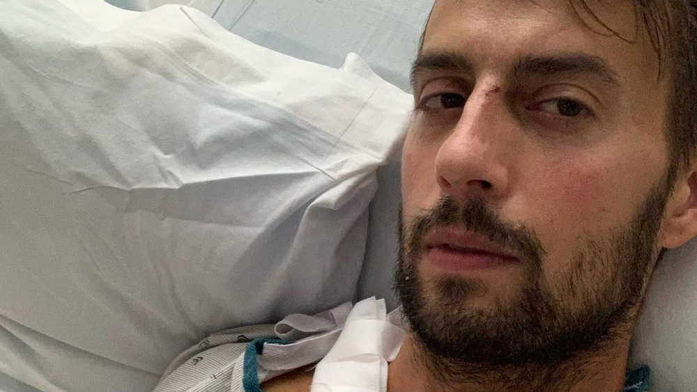 Ryan Fischer recovers in a hospital bed after being shot