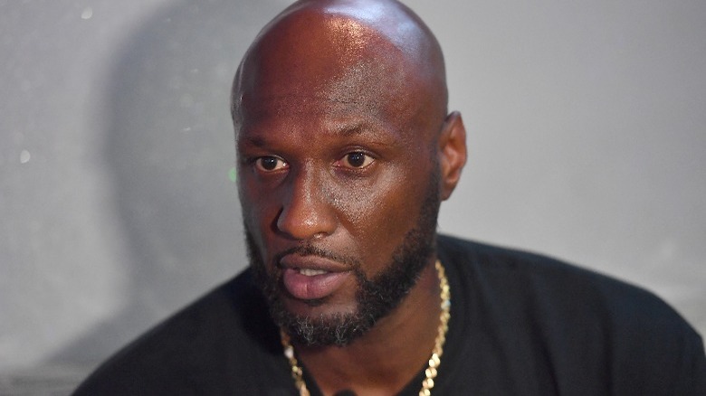 Lamar Odom wearing black t-shirt with serious expression