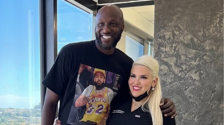 Lamar Odom and Dr. Victoria Veytsman pose and smile