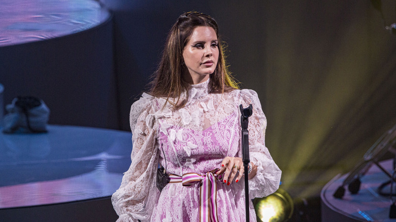 Lana Del Rey standing onstage