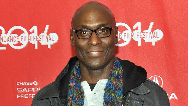 Lance Reddick with scarf and warm jacket