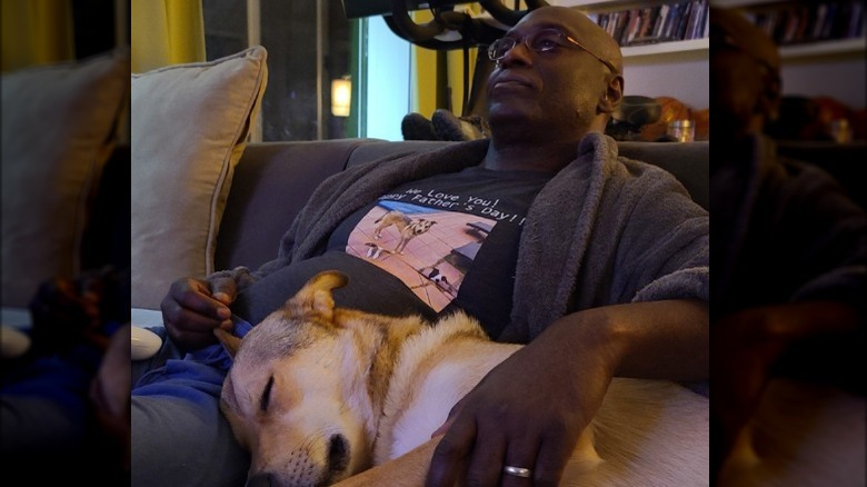 Lance Reddick and his dog on the couch 