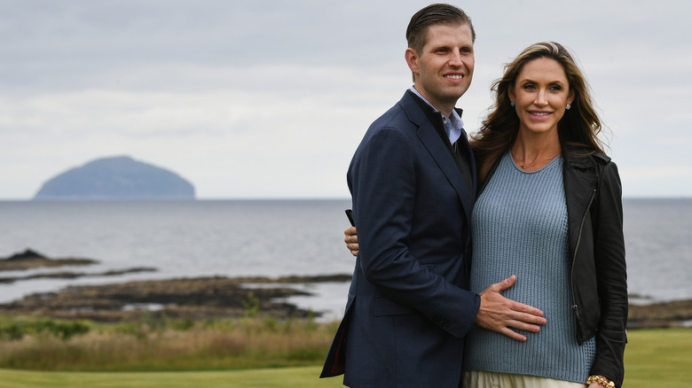 Eric Trump placing hand on Lara Trump's stomach