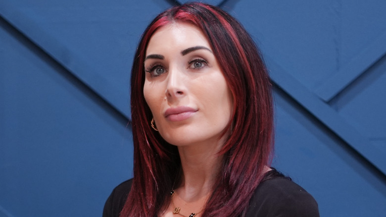 Laura Loomer with red hair streaks