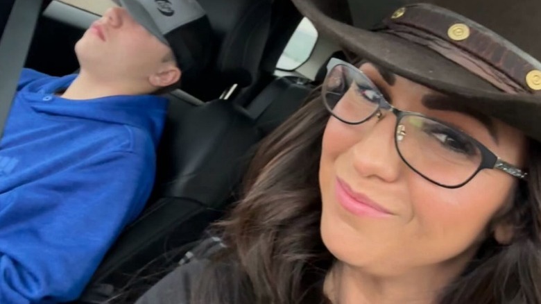 Lauren Boebert takes a selfie that reveals her son asleep in the car with her