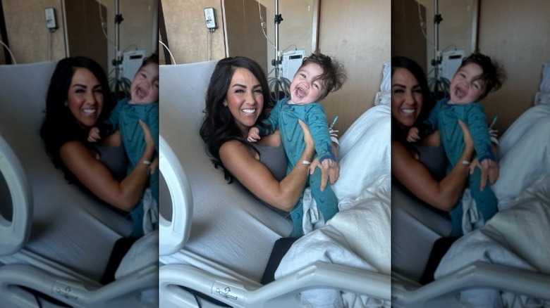 Lauren Boebert poses with grandson in a hospital bed