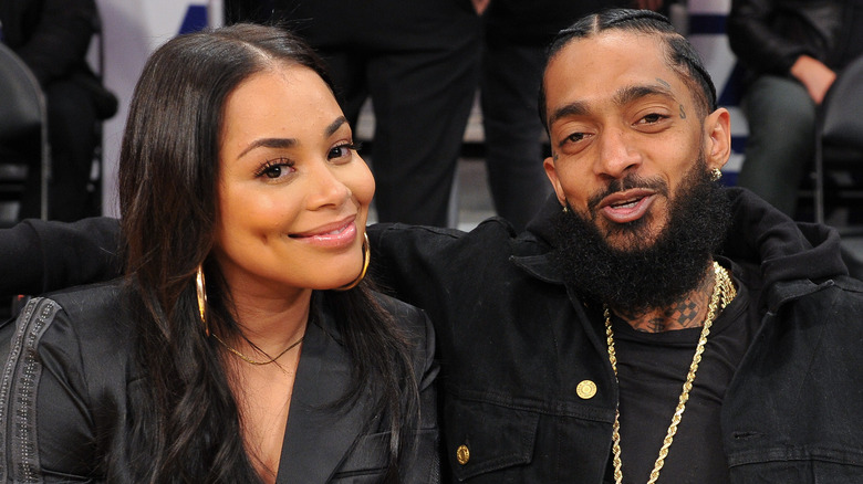 Lauren London and Nipsey Hussle smiling