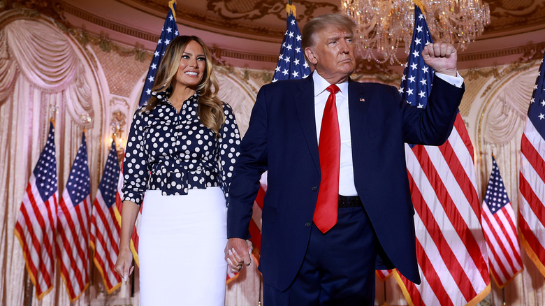 Melania and Donald Trump holding hands