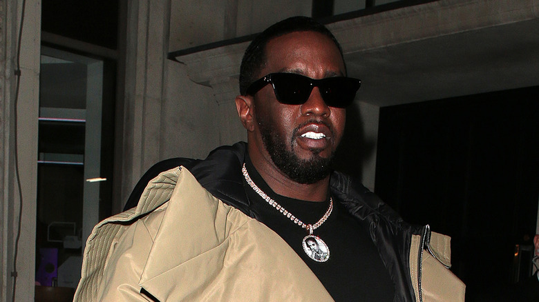 Sean Diddy Combs walking with black sunglasses