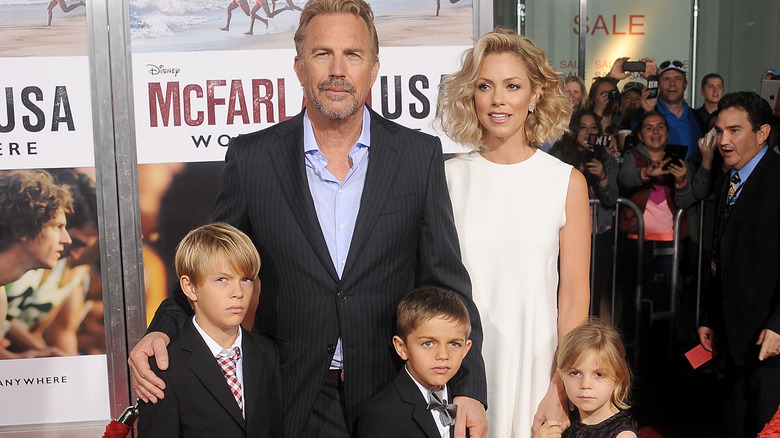 Kevin Costner poses with his family