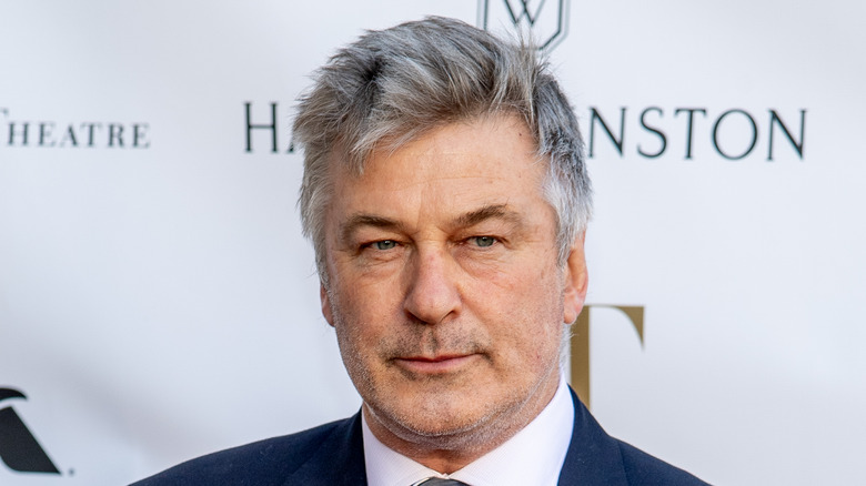 Alec Baldwin not smiling in suit