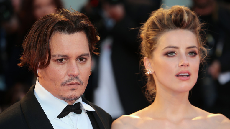 Johnny Depp and Amber Heard posing