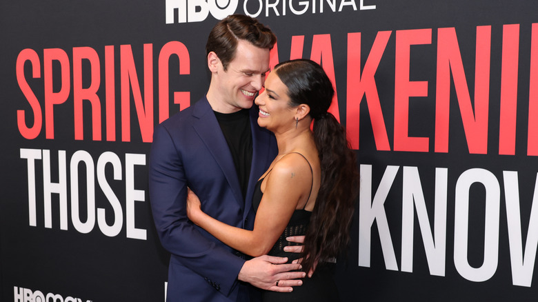 Jonathan Groff and Lea Michele hugging and laughing