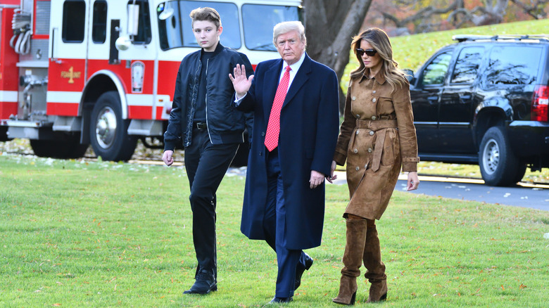 Barron, Donald, and Melania Trump walking