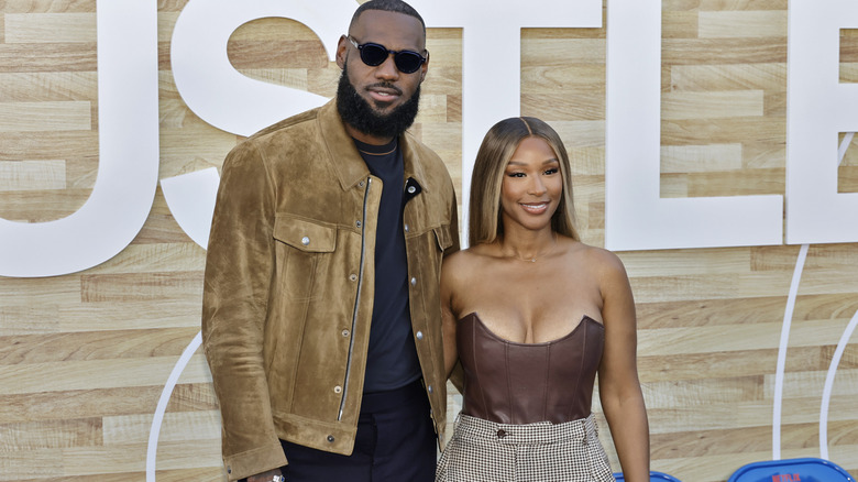 Lebron James and savannah James posing at the "Hustle" premiere