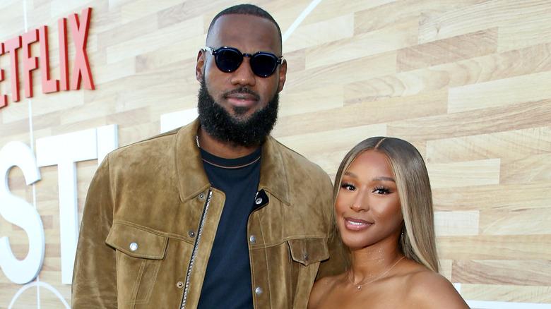 LeBron and Savannah James with Netflix logo in the background.